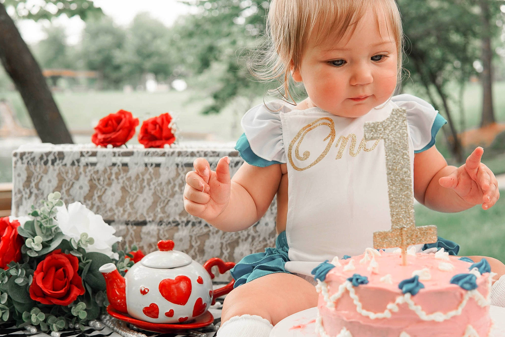 Emmalynn is registered to the contest to win money with this photo: baby, baby_toddler_clothing, birthday_cake, cake_decorating_supply, dessert, dress, event, flower, grass, happy, orange, people, person, petal, pink, plant, red, rose, sugar_cake, textile