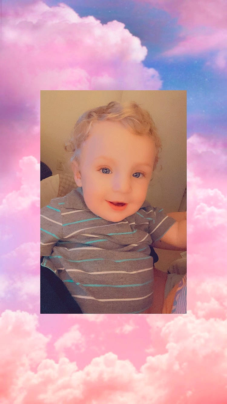 Tayshawn is registered to the contest to win money with this photo: art, azure, baby, baby_toddler_clothing, cheek, child, cloud, cumulus, electric_blue, flash_photography, fun, happy, iris, magenta, people_in_nature, person, pink, skin, sky, smile