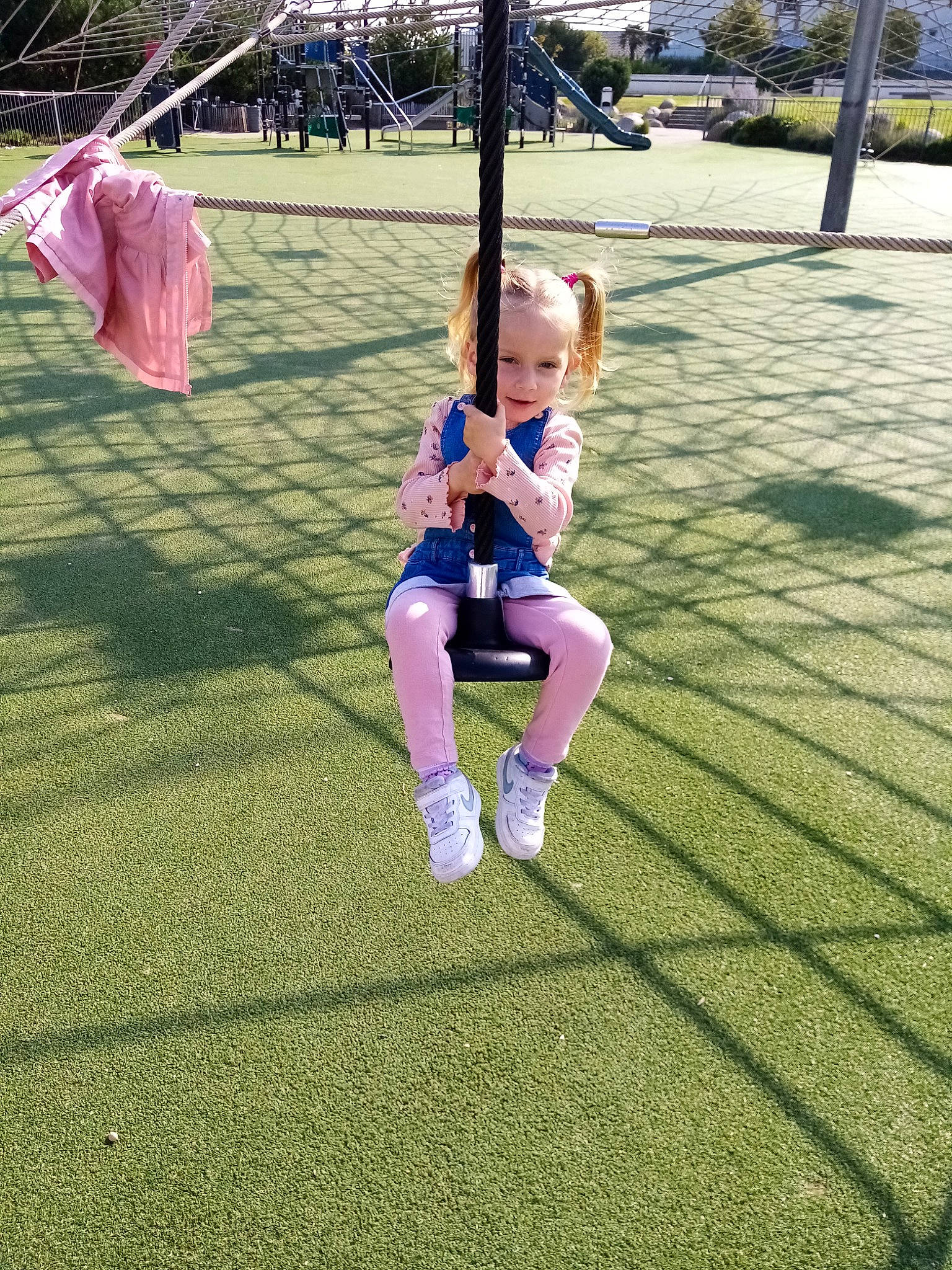 Maleina participe au concours pour gagner de l'argent avec cette photo : child, city, flooring, fun, grass, grassland, happy, human_leg, knee, leisure, people_in_nature, person, plant, playground, recreation, shorts, sportswear, swing, t_shirt, thigh