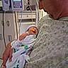Chaos joined the competition — help win amazing prizes! adult, baby, bedroom, blanket, care, cute, face, gown, healthcare, holding, hospital, indoors, infant, love, medical_equipment, newborn, parent, person, portrait, smile