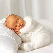 Otto joined the competition — help win amazing prizes! newborn, baby, sleeping, white_outfit, pillow, soft_texture, cozy, peaceful, infant, portrait, cute, knitted_clothing, resting, indoor, blanket, calm, child, face, peace, toddler