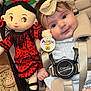 Sundae is registered to the contest to win money with this photo: baby, child, doll, stroller, headband, smile, infant, toy, red_dress, face, cute, baby_clothes, seatbelt, indoor, person, child_safety, plush, happy, portrait, young