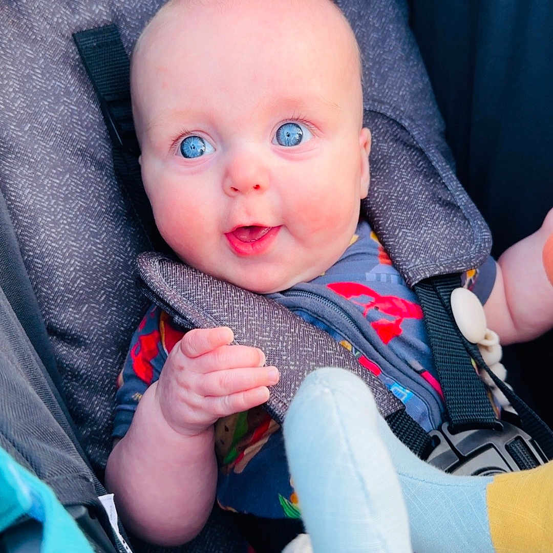 Bryce joined the competition — help win amazing prizes! baby, blue_eyes, car_seat, child, cute, infant, colorful_clothing, soft_toys, smiling, hand, face, portrait, seatbelt, child_in_car_seat, indoors, happy, person, baby_toys, closeup, young_child