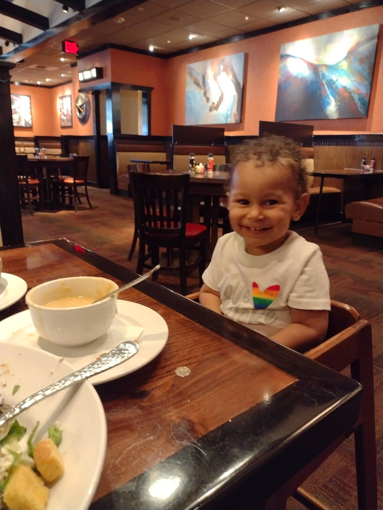 Gabriela joined the competition — help win amazing prizes! caffe_macchiato, chair, coffee, coffee_cup, cortado, cup, dishware, drinkware, flat_white, food, furniture, ingredient, joy, person, plate, saucer, serveware, smile, table, tableware