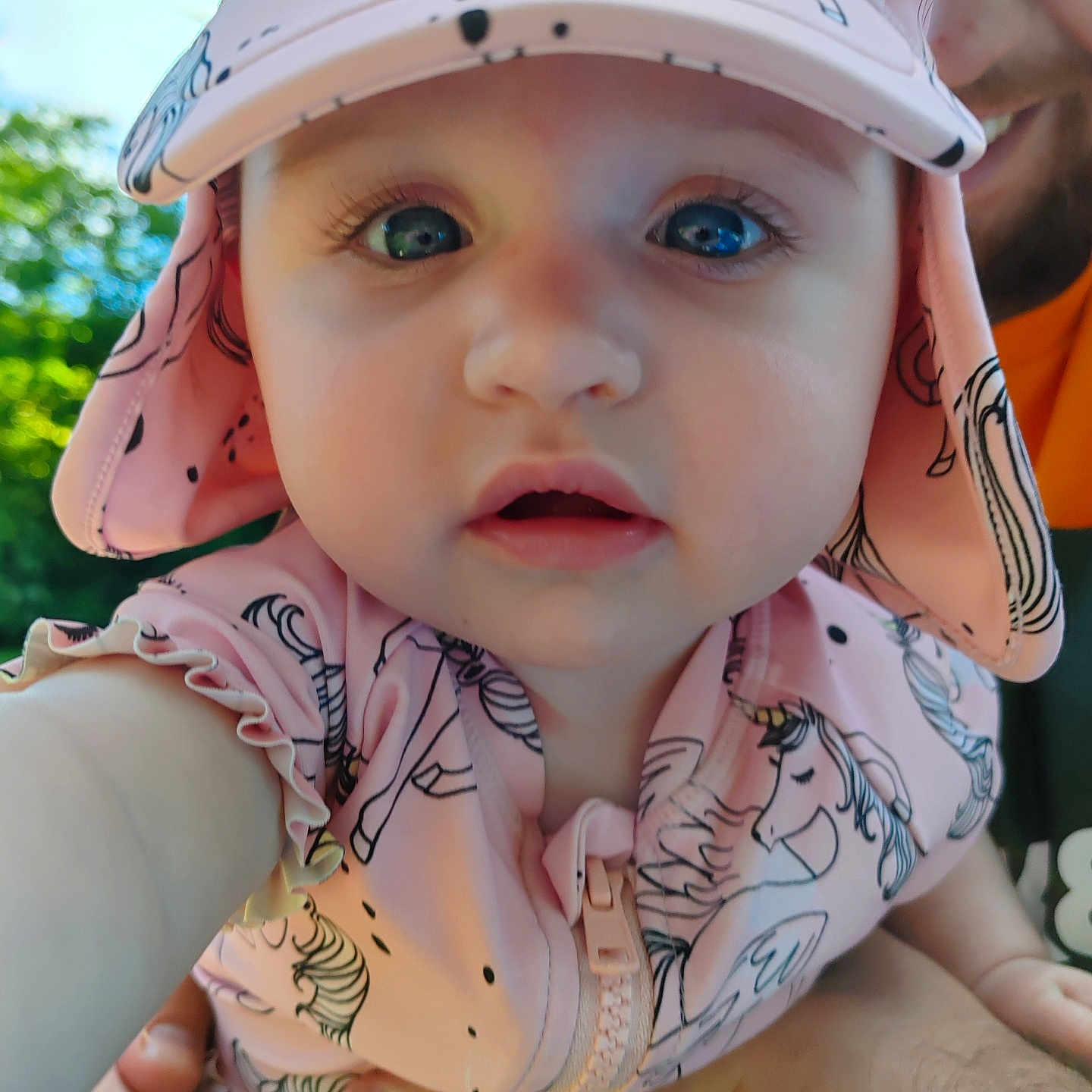 Eden is registered to the contest to win money with this photo: applique, baby, baseballcap, bodypart, bonnet, cap, clothing, dress, face, finger, hand, hat, head, hood, newborn, pattern, person, photography, portrait, sunhat