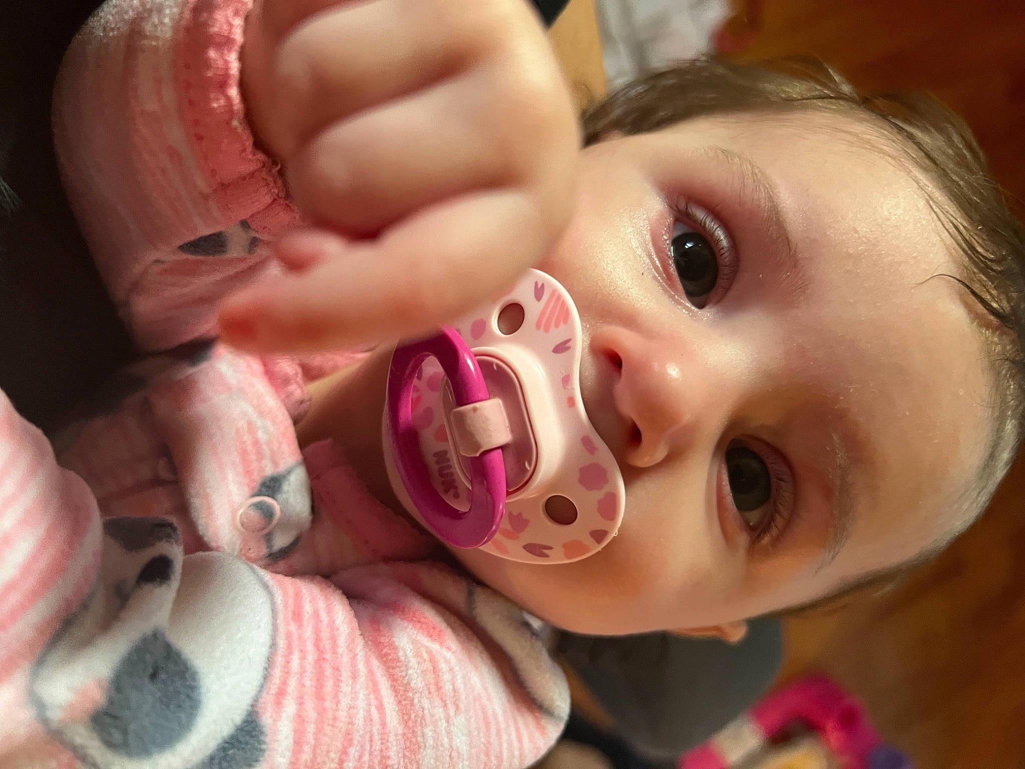 Kayleigh is registered to the contest to win money with this photo: baby, cheek, chin, ear, eye, eyebrow, eyelash, face, gesture, happy, head, human_body, iris, jaw, lip, mouth, nose, person, pink, skin