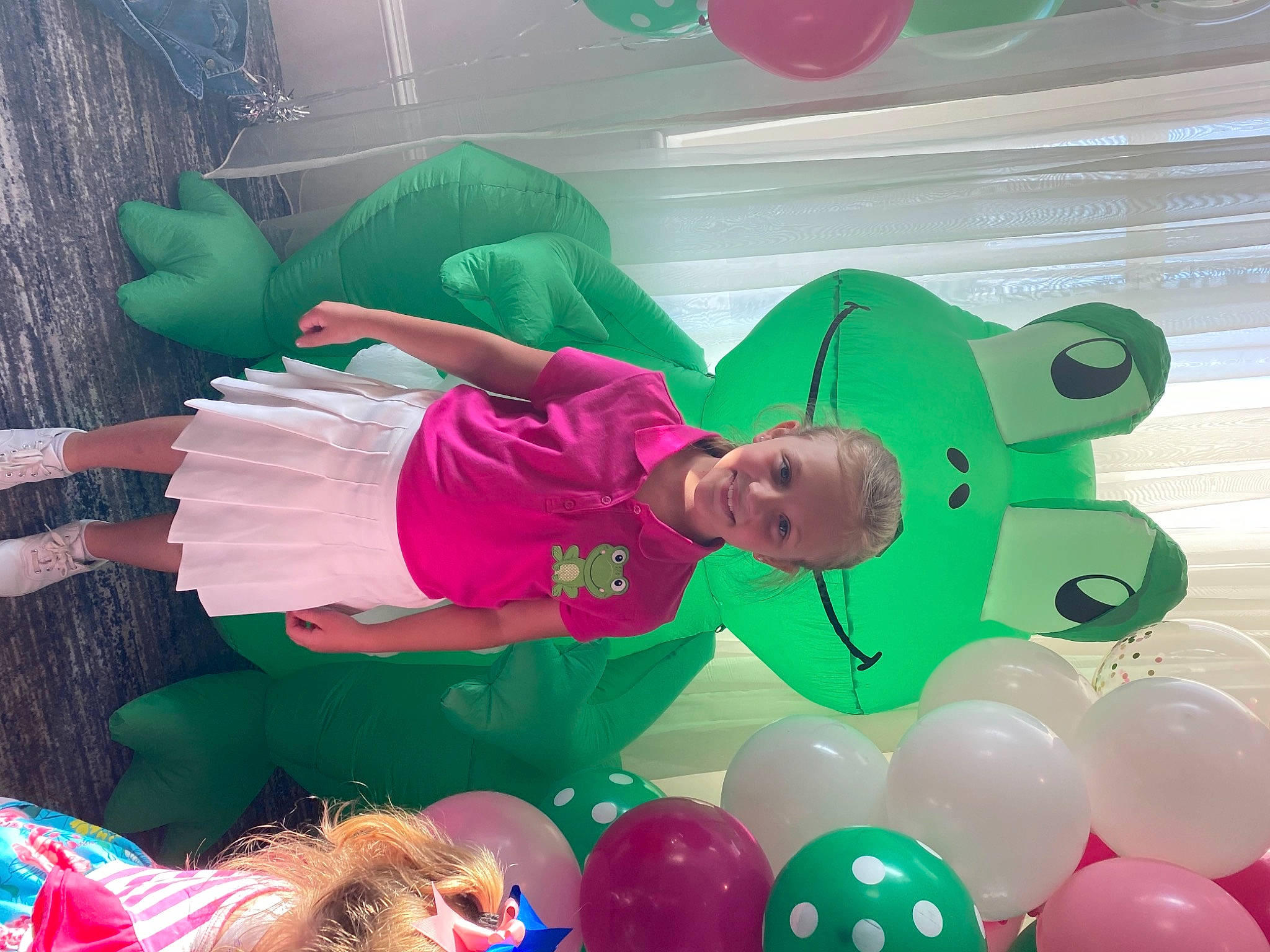 Kristan joined the competition — help win amazing prizes! baby_toddler_clothing, balloon, child, event, fun, green, happy, inflatable, joy, leisure, magenta, organism, party_supply, person, photograph, pink, product, recreation, smile, snapshot