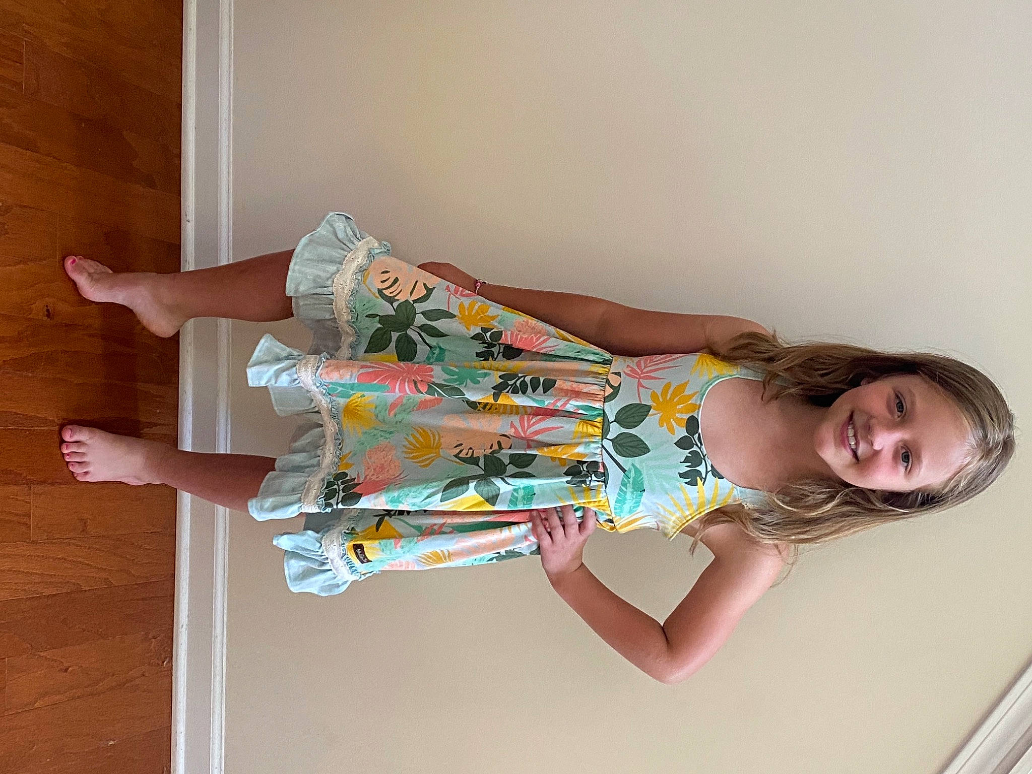 Kristan is registered to the contest to win money with this photo: arm, baby_toddler_clothing, comfort, day_dress, dress, elbow, fun, hair, hand, happy, human_leg, joy, knee, leg, person, pink, room, sleeve, smile, thigh