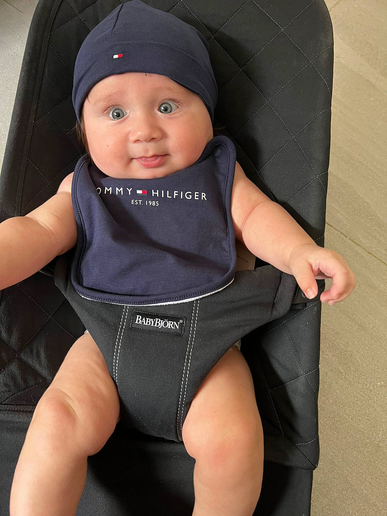 Kaya is registered to the contest to win money with this photo: auto_part, baby, baby_products, baby_safety, baby_toddler_clothing, cheek, comfort, electric_blue, fashion_accessory, finger, headgear, headwear, knee, person, personal_protective_equipment, product, sleeve, smile, swimwear, thigh