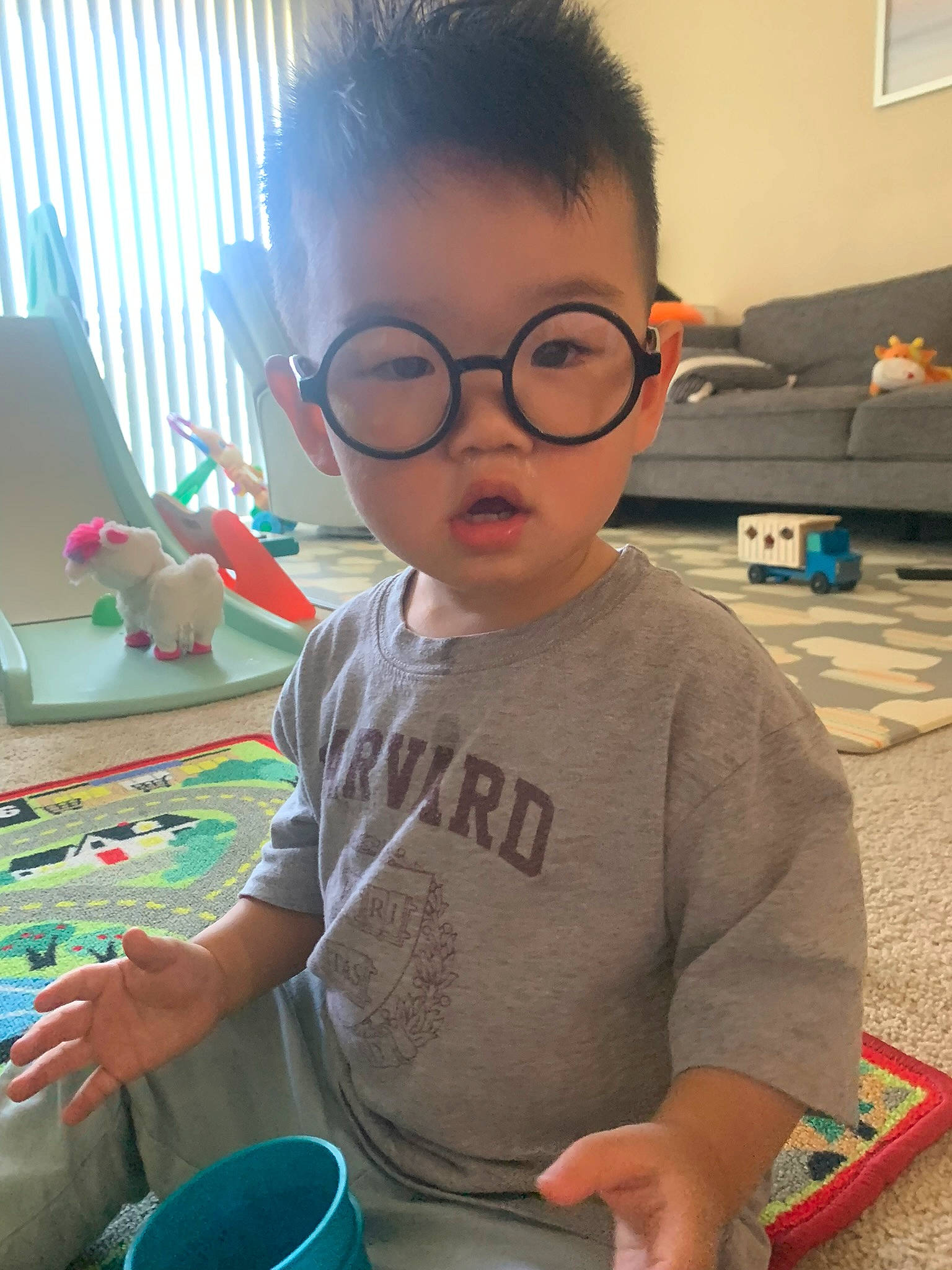 Julien joined the competition — help win amazing prizes! audio_equipment, chair, child, desk, engineering, eyewear, fun, gadget, glasses, happy, learning, leisure, person, personal_protective_equipment, play, room, sitting, t_shirt, toddler, vacation