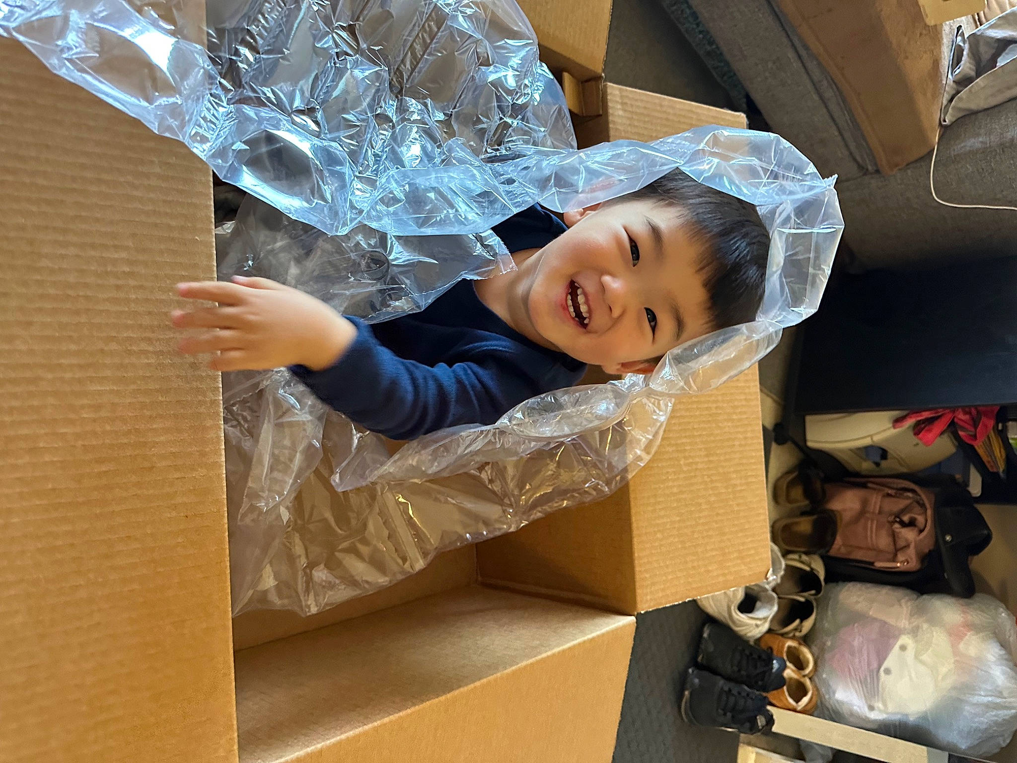 Julien is registered to the contest to win money with this photo: automotive_design, automotive_exterior, automotive_lighting, bag, box, bridal_accessory, child, fashion_accessory, flooring, happy, hat, luggage_and_bags, person, plastic, room, smile, textile, tire, toddler, vehicle_door