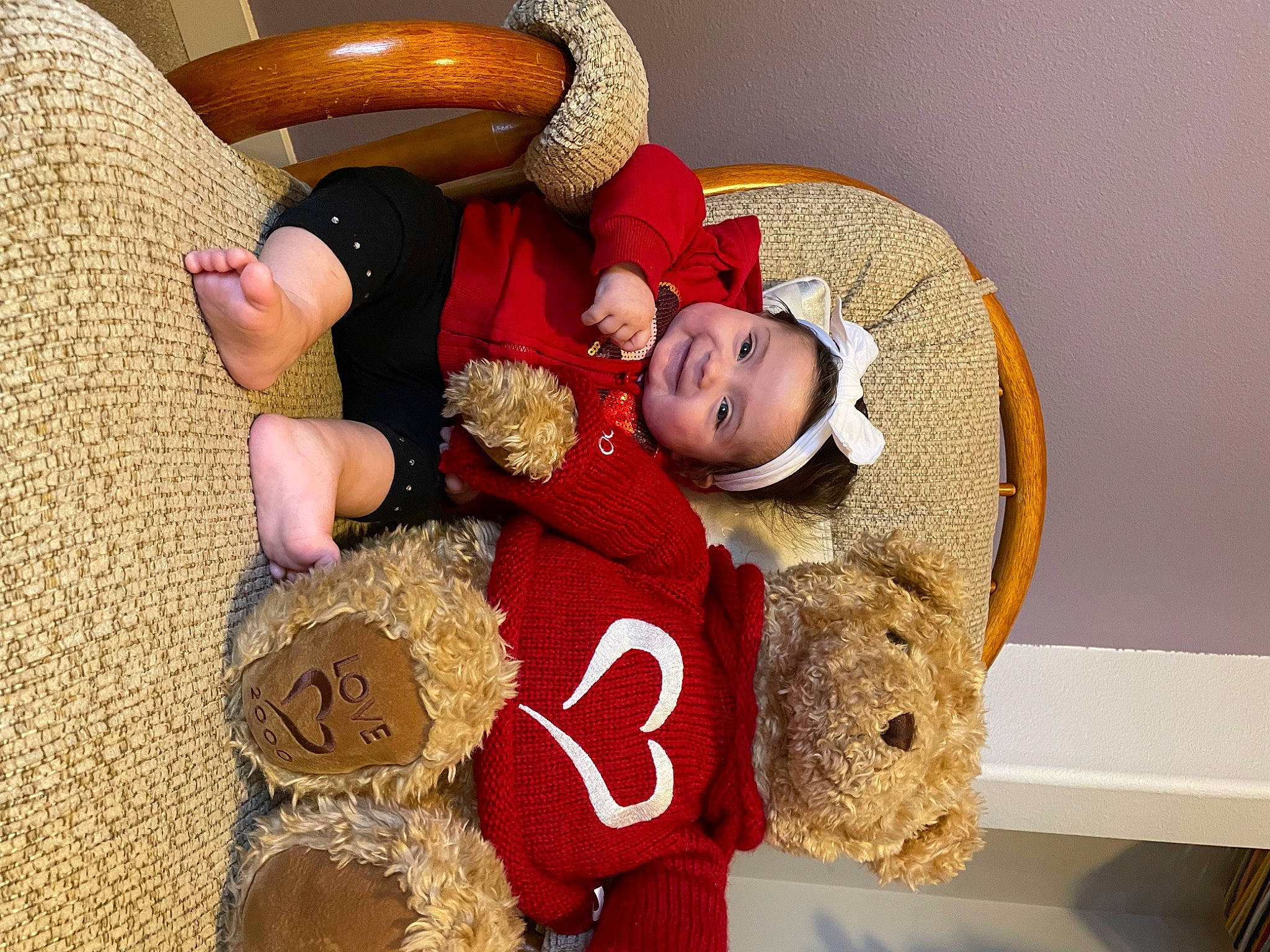 Nevaeh joined the competition — help win amazing prizes! baby, child, comfort, couch, flooring, fun, fur, happy, hat, headgear, person, plush, room, smile, stuffed_toy, teddy_bear, textile, toddler, toy, wood