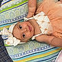 Olive joined the competition — help win amazing prizes! baby, child, infant, tutu, headband, cushion, pattern, colorful, smile, face, skin, clothing, lying_down, indoor, cute, portrait, looking, baby_girl, soft, fabric