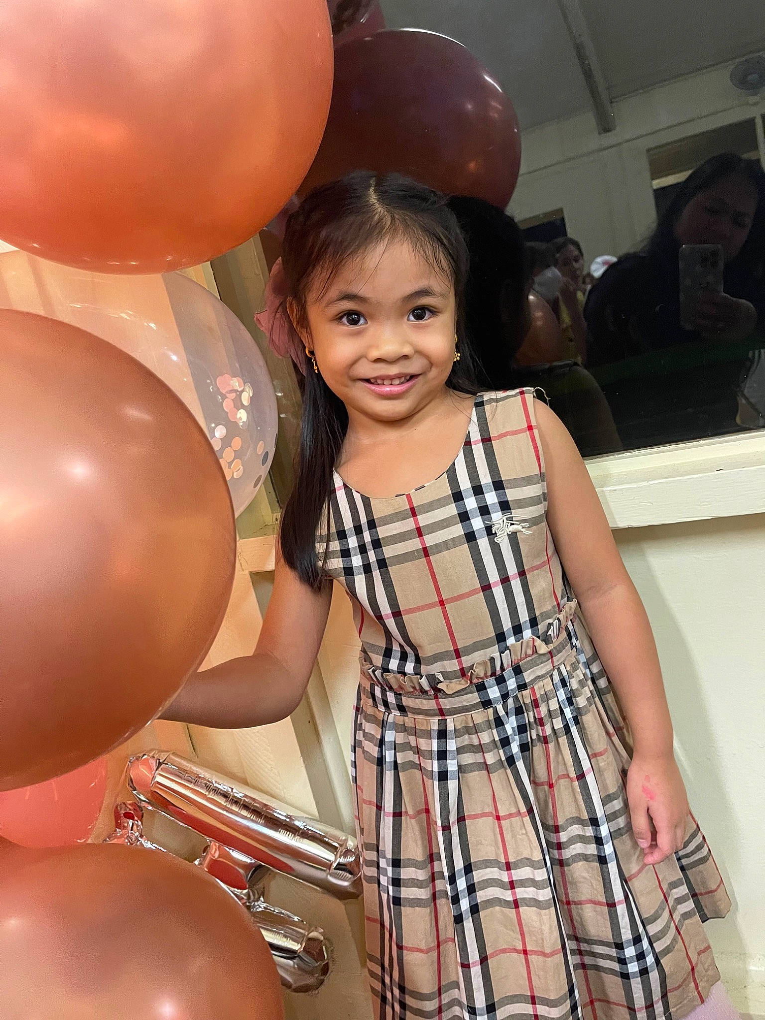 Maiah is registered to the contest to win money with this photo: balloon, beauty, child, day_dress, dress, event, fashion_design, fun, happy, human_leg, joint, joy, one_piece_garment, party_supply, person, plaid, shoulder, skin, smile, tartan