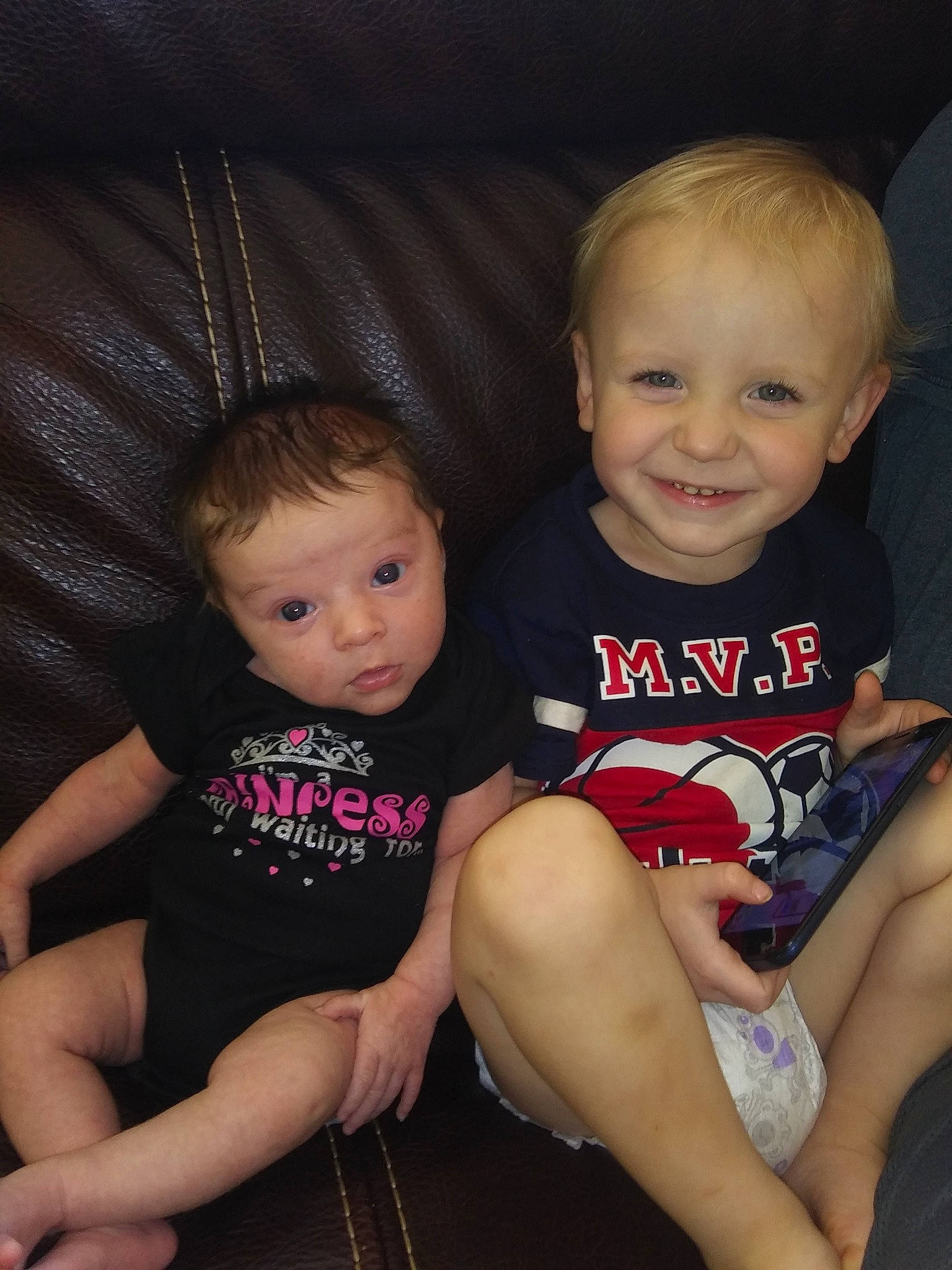 Abrielle is registered to the contest to win money with this photo: arm, cheek, child, daughter, eye, family, finger, fun, head, human_body, iris, joy, lap, leg, people, person, sibling, sitting, skin, smile