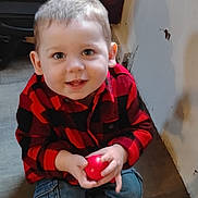 Calvin joined the competition — help win amazing prizes! toddler, child, smiling, red_ball, barefoot, jeans, checkered_shirt, indoor, floor, window, shelf, toy, happy, young_child, person, casual_clothing, light, face, hands, sitting