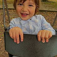 Mcallister is registered to the contest to win money with this photo: child, swing, playground, smiling, happy, outdoor, pajamas, autumn, trees, park, nature, hands, face, person, seat, clothing, daylight, fun, cute, leaves