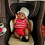 Zipporah joined the competition — help win amazing prizes! baby, car_seat, sleeping, infant, hat, clothing, footwear, red, white, pink, cute, resting, indoor, child, person, soft, cozy, seat, apparel, newborn