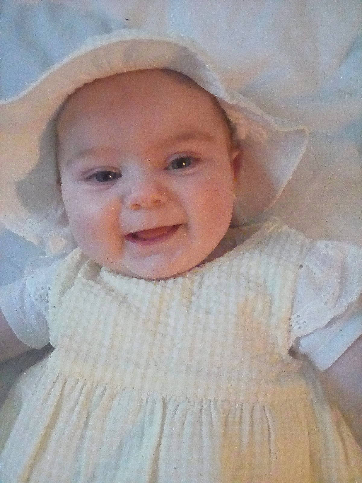 Lilly-mae joined the competition — help win amazing prizes! baby, baby_laughing, baby_making_funny_faces, bonnet, cheek, child, dress, eye, face, facial_expression, head, headgear, headwear, lip, nose, person, portrait, skin, smile, toddler