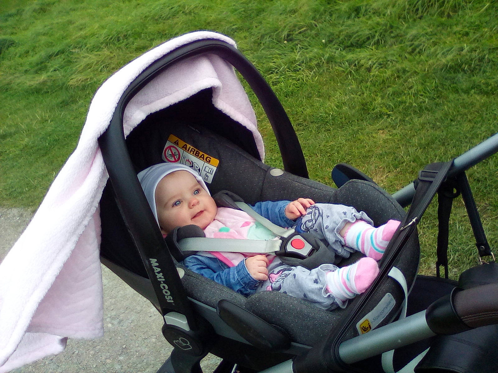 Lilly-mae is registered to the contest to win money with this photo: baby, baby_carriage, baby_carrier, baby_products, child, grass, headwear, leisure, person, product