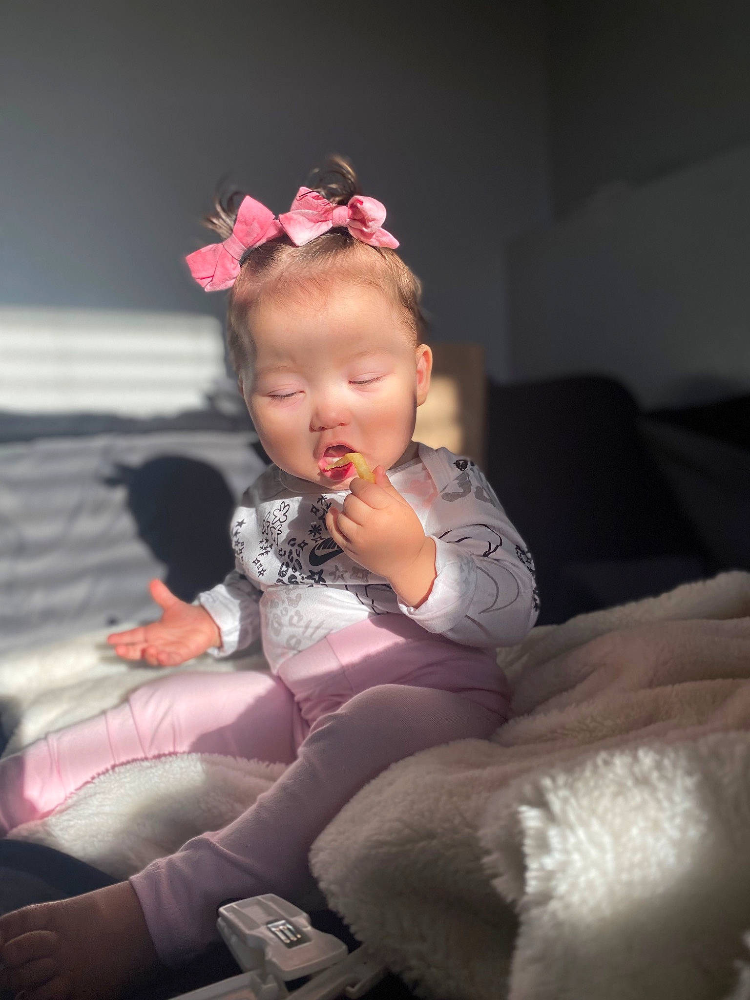 Aniyah is registered to the contest to win money with this photo: baby, baby_toddler_clothing, child, comfort, event, fashion_accessory, fashion_design, flash_photography, fun, fur, head, headband, headpiece, human_leg, lap, magenta, person, pink, sitting, sock