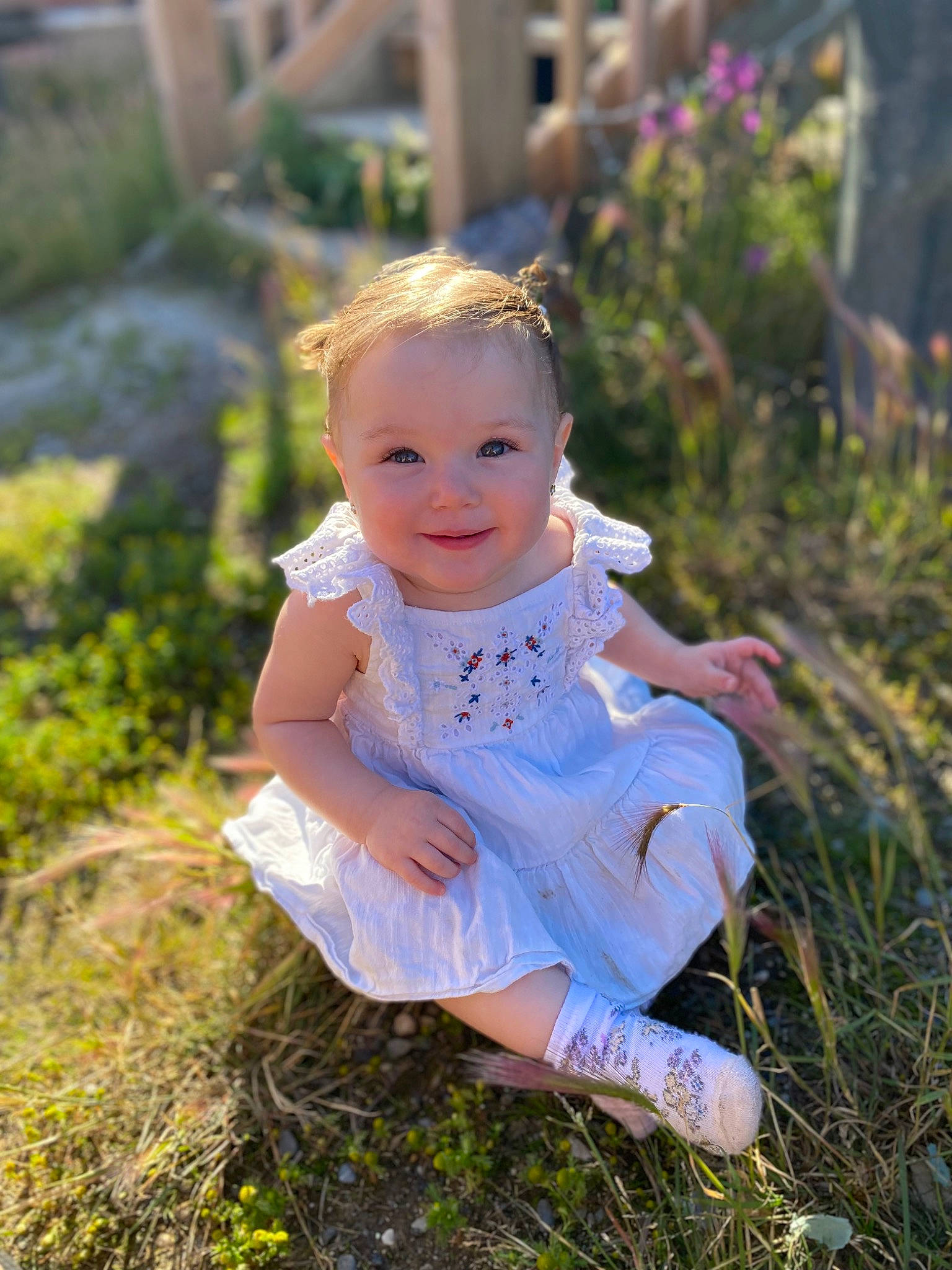 Atlee is registered to the contest to win money with this photo: baby, baby_toddler_clothing, blond, eye, face, flash_photography, fun, grass, grass_family, happy, iris, joy, leaf, people_in_nature, person, plant, skin, smile, summer, sunlight