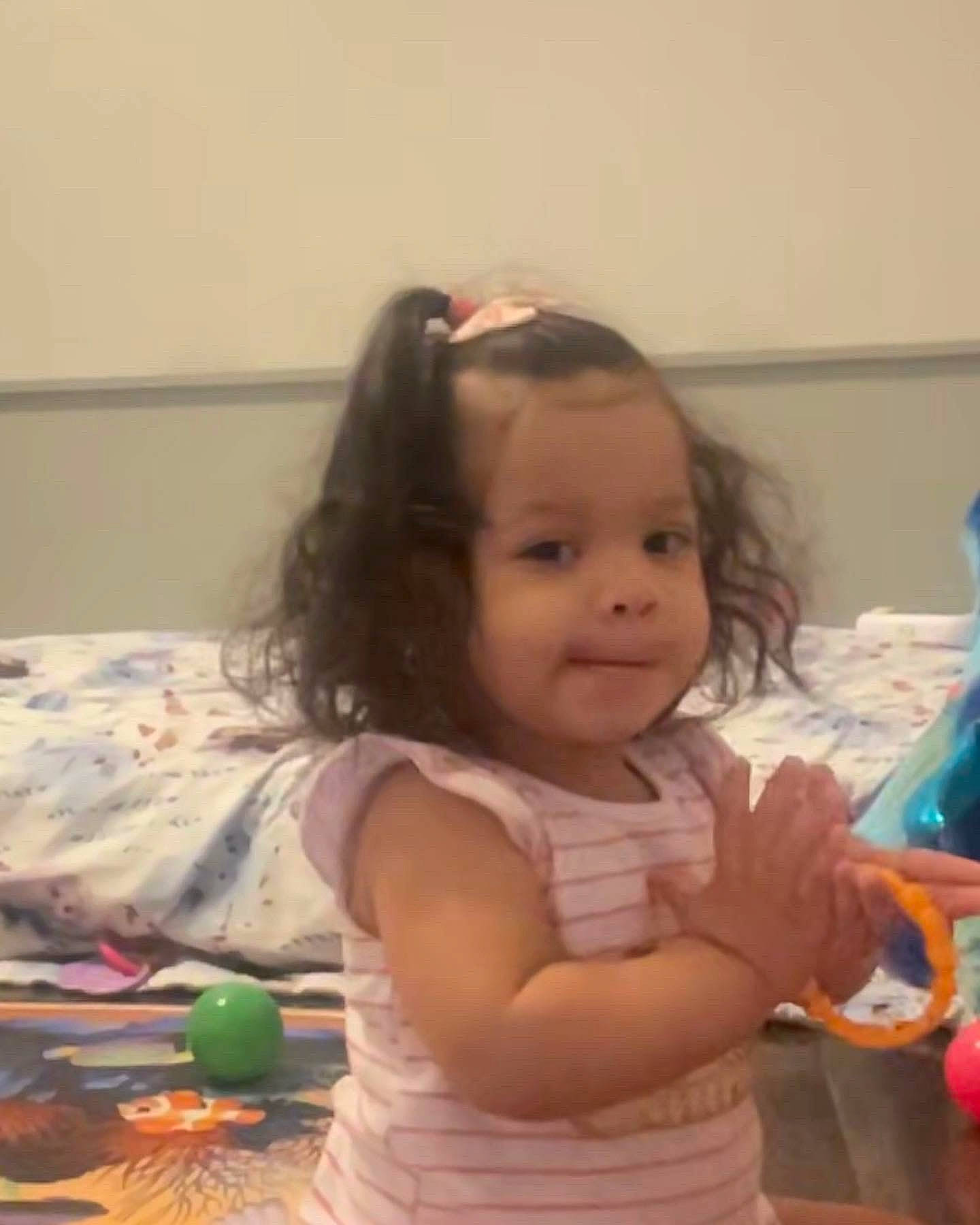 Kartier is registered to the contest to win money with this photo: arm, baby, cheek, child, ear, finger, fun, hair, happy, head, iris, long_hair, mouth, neck, nose, person, room, sitting, skin, thumb