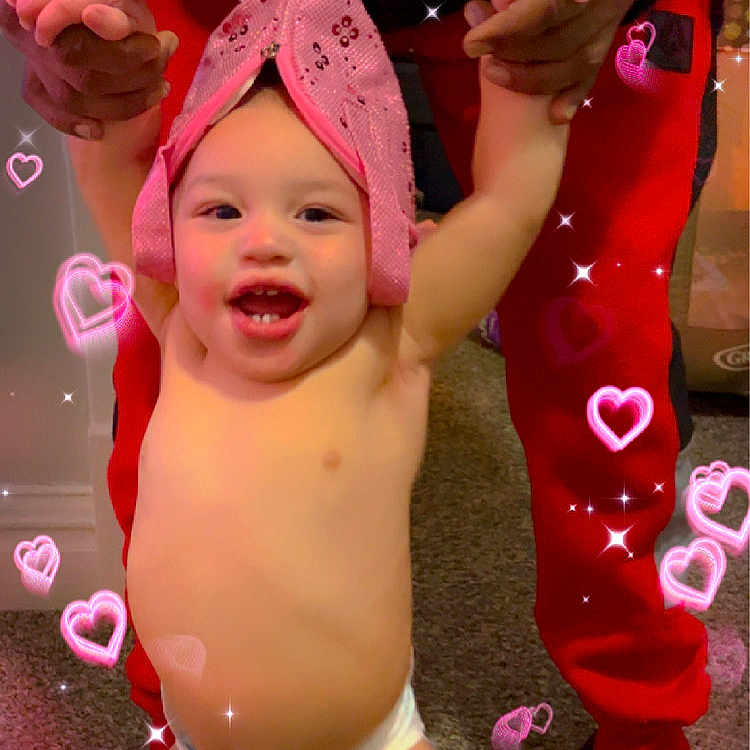 Roice is registered to the contest to win money with this photo: baby, baseballcap, bodypart, bonnet, cap, clothing, diaper, face, finger, footwear, hand, hat, head, mouth, person, photography, portrait, sandal, shoe, shorts