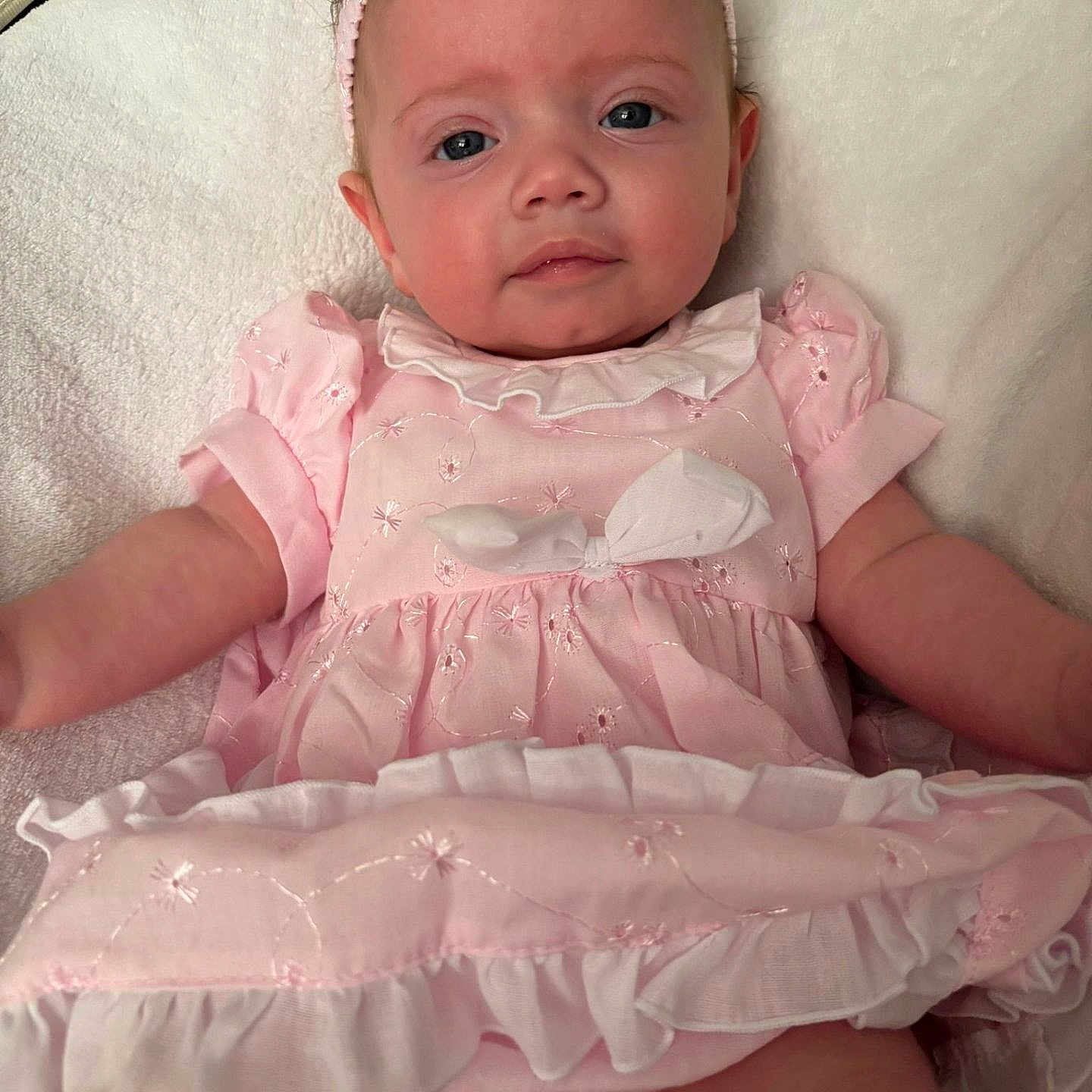 Amy-Mae joined the competition — help win amazing prizes! adorable, baby, baby_girl, blue_eyes, bow, child, clothing, cute, face, headband, infant, lying_down, pink_dress, portrait, resting, skin, small_hands, soft_texture, towel, young