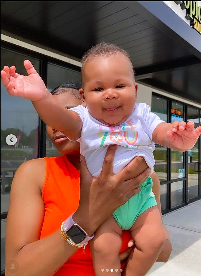 Ci'Erra joined the competition — help win amazing prizes! baby_toddler_clothing, cheek, facial_expression, finger, fun, gesture, hand, happy, joint, joy, leg, leisure, muscle, person, pink, skin, smile, thigh, thumb, toddler