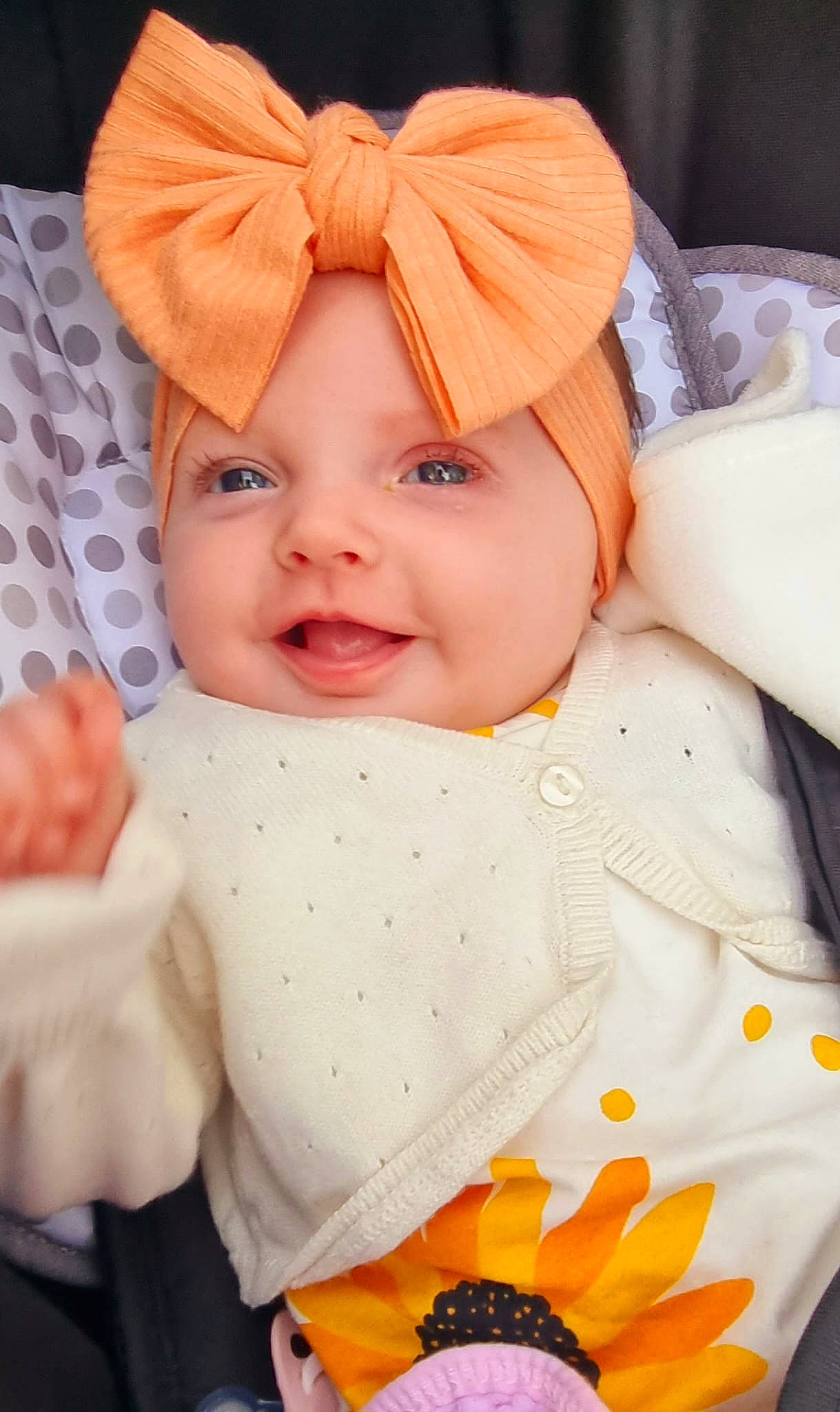 Ariella is registered to the contest to win money with this photo: baby, baby_products, baby_toddler_clothing, cheek, child, chin, happy, hat, headwear, iris, lip, outerwear, person, pink, product, skin, sleeve, smile, textile, toddler
