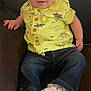 Hunter joined the competition — help win amazing prizes! baby, child, sitting, couch, yellow_shirt, dinosaur_print, blue_jeans, white_sneakers, face, smiling, indoor, young_child, cute, casual_clothing, footwear, portrait, person, happy, seated, infant