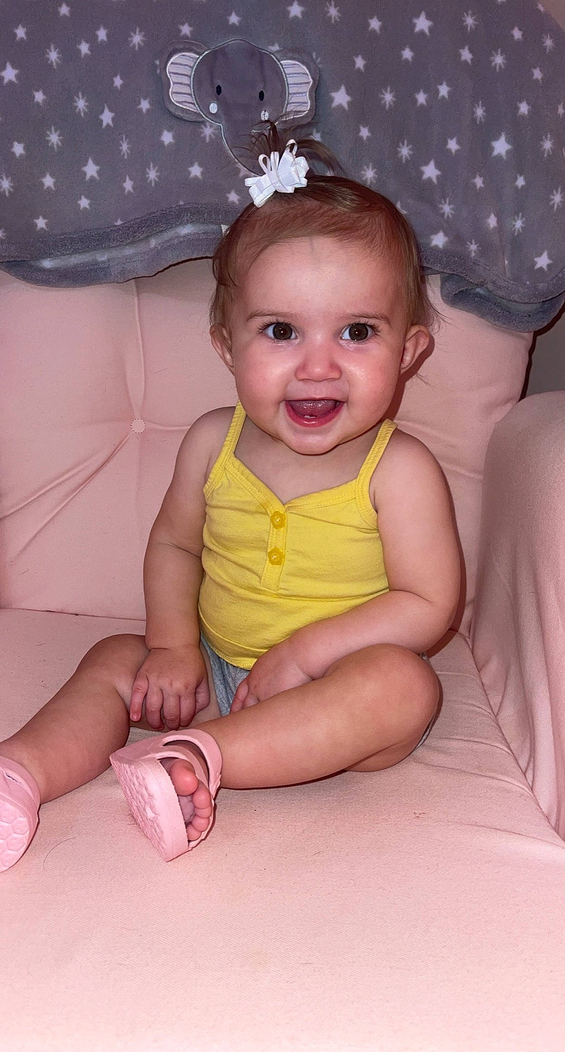 Stella is registered to the contest to win money with this photo: baby, baby_toddler_clothing, beauty, cheek, child, facial_expression, finger, fun, hairstyle, happy, head, iris, pattern, person, pink, purple, skin, smile, textile, toddler