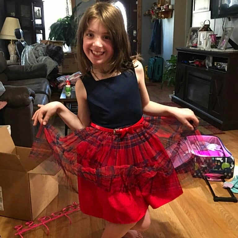 Sophia is registered to the contest to win money with this photo: architecture, building, clothing, computerhardware, costume, dress, electronics, face, furniture, hardware, head, indoors, livingroom, monitor, person, photography, portrait, room, screen, skirt