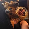 Tóny a rejoint le concours — aidez-le/la à gagner de superbes lots ! dog, person, selfie, outdoor, sunglasses, smile, hair, leg, black_clothing, light_bulbs, sky, clouds, fur, pet, cute, casual, happy, portrait, friendship, relaxation