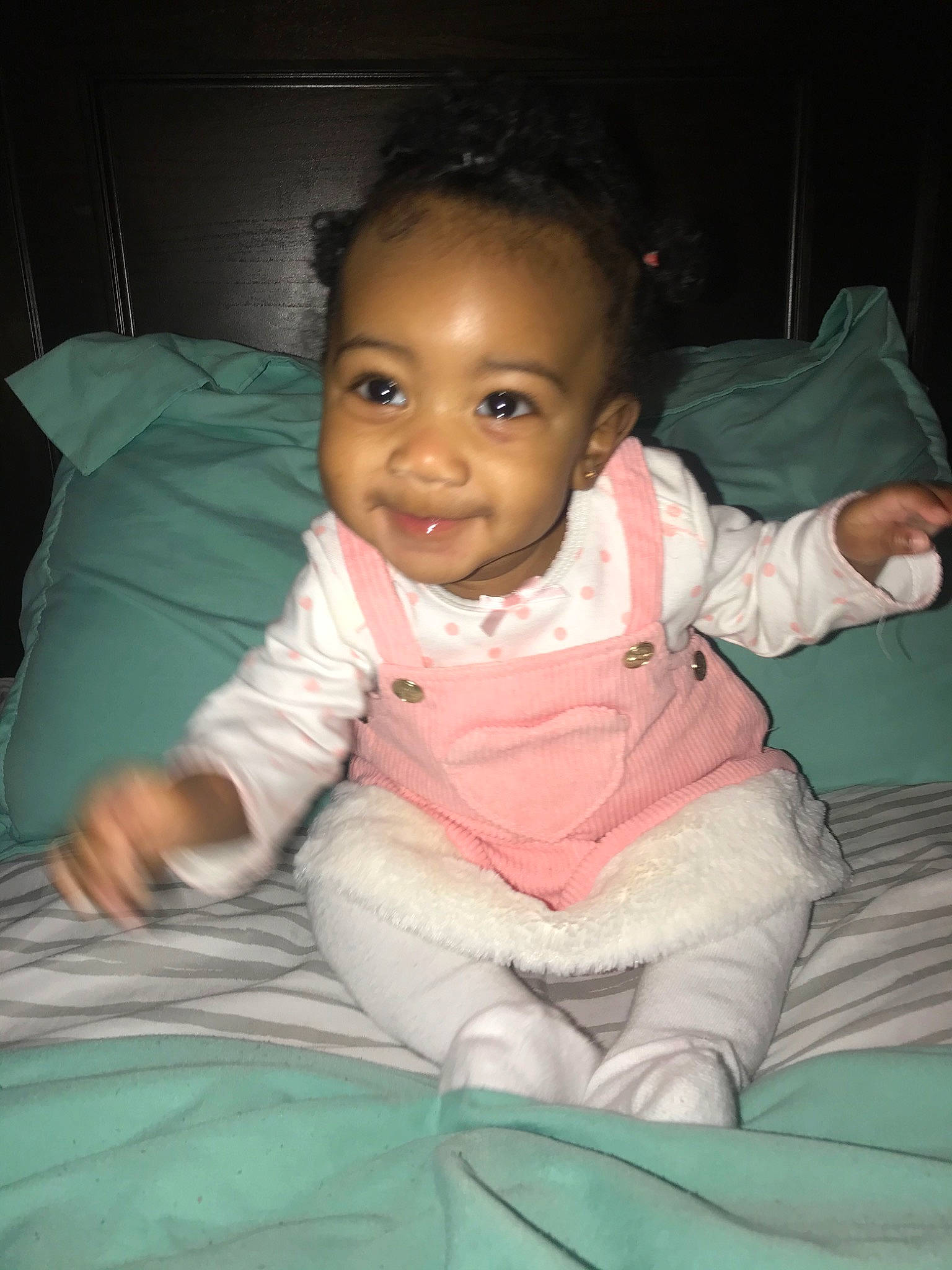 Cherish is registered to the contest to win money with this photo: baby, black_hair, cheek, child, eye, face, forehead, head, joy, lip, nose, person, pink, sitting, skin, smile, toddler