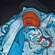 Jamison joined the competition — help win amazing prizes! newborn, baby, blanket, sleeping, hat, infant, hospital, bracelet, clothing, dinosaur_print, cute, swaddled, soft, resting, child, indoors, person, face, tiny, peaceful