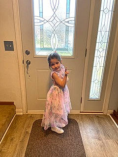 Eleanor is registered to the contest to win money with this photo: door, dress, event, fashion_design, fawn, floor, flooring, fur, happy, hardwood, human_leg, joy, laminate_flooring, person, room, sitting, toddler, varnish, window, wood