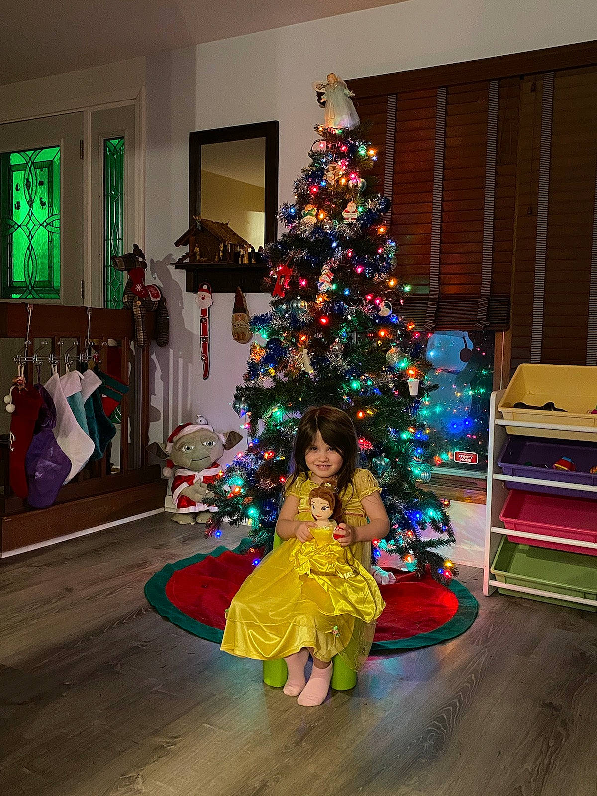 Eleanor is registered to the contest to win money with this photo: christmas, christmas_decoration, christmas_eve, christmas_ornament, christmas_tree, conifer, event, evergreen, flooring, fun, holiday, holiday_ornament, home, interior_design, joy, ornament, person, plant, tradition, tree