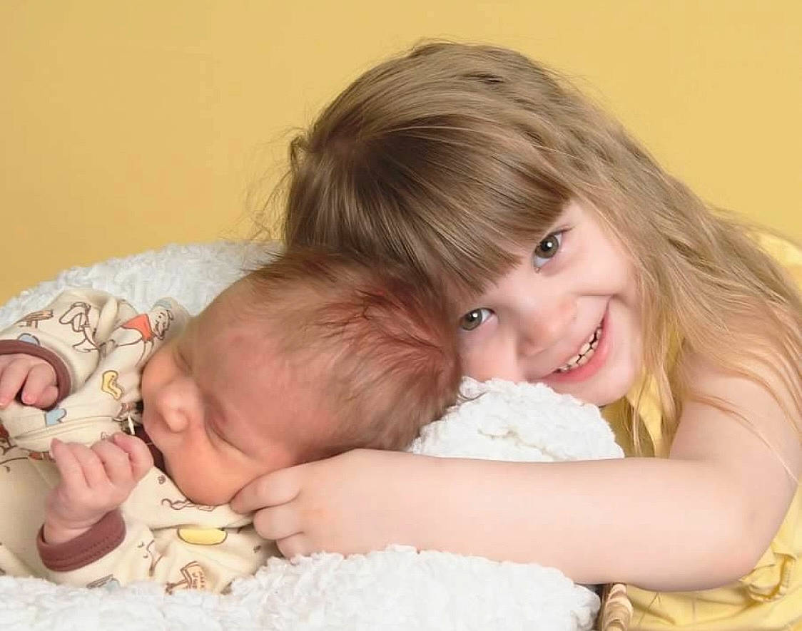 Audreianna joined the competition — help win amazing prizes! baby, baby_sleeping, baby_toddler_clothing, cheek, child, comfort, couch, event, finger, gesture, happy, hug, iris, joy, linens, person, portrait_photography, sharing, sitting, skin