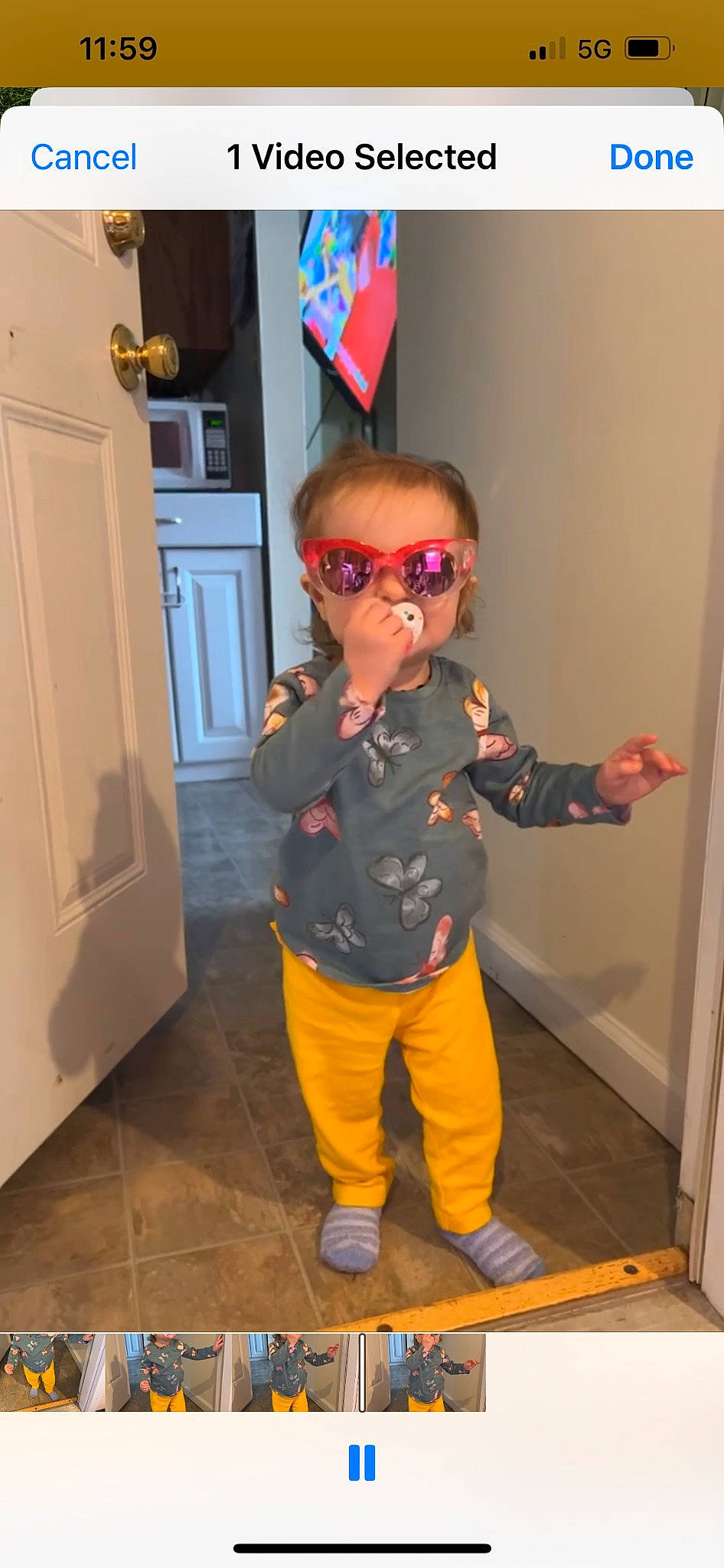 Charlotte is registered to the contest to win money with this photo: baby_toddler_clothing, child, costume, door, electric_blue, eyewear, floor, flooring, fun, goggles, hardwood, outerwear, person, personal_protective_equipment, sleeve, standing, sunglasses, t_shirt, toddler, vision_care