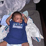 Yosohn joined the competition — help win amazing prizes! baby, sleeping, infant, diaper, blue_shirt, blanket, couch, cozy, soft_texture, relaxing, child, young, cute, peaceful, indoors, person, clothing, resting, comfort, toddler