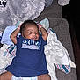 Yosohn is registered to the contest to win money with this photo: baby, sleeping, infant, diaper, blue_shirt, blanket, couch, cozy, soft_texture, relaxing, child, young, cute, peaceful, indoors, person, clothing, resting, comfort, toddler