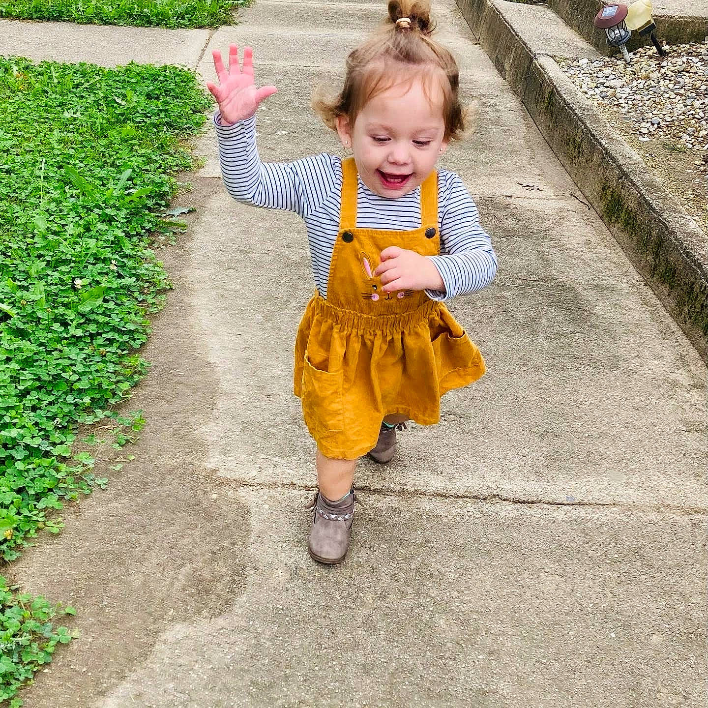 Esperanza is registered to the contest to win money with this photo: asphalt, baby, baby_toddler_clothing, blond, child, dress, fun, grass, hairstyle, happy, head, leisure, people_in_nature, person, plant, recreation, road, road_surface, sidewalk, smile