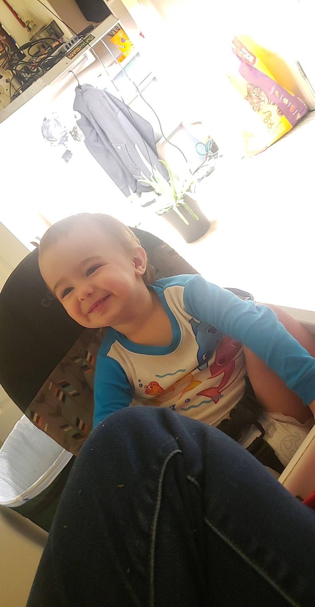 Dorian is registered to the contest to win money with this photo: auto_part, automotive_design, automotive_exterior, automotive_lighting, automotive_wheel_system, baby, child, comfort, elbow, fun, happy, joy, leisure, luxury_vehicle, motor_vehicle, person, sitting, smile, t_shirt, toddler