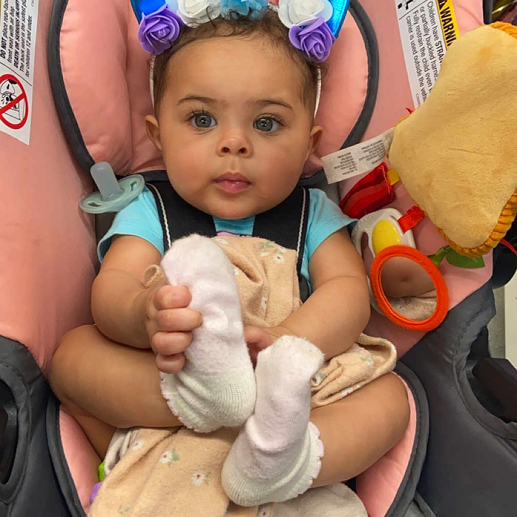 Azaria is registered to the contest to win money with this photo: accessories, baby, bodypart, cap, clothing, cushion, face, finger, hand, hat, head, homedecor, hosiery, person, photography, portrait, sock, stroller, sunglasses, transportation
