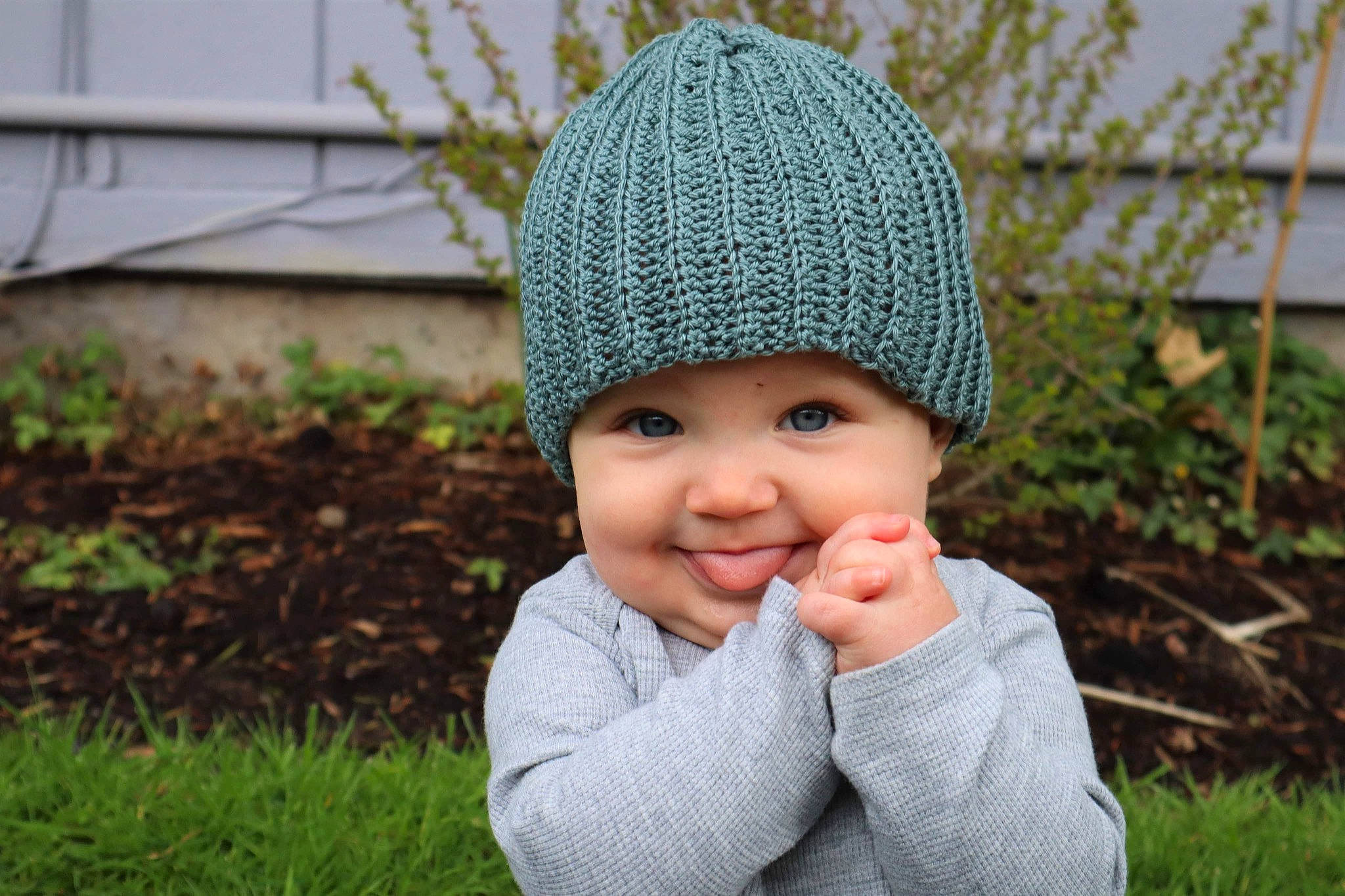 Jericho joined the competition — help win amazing prizes! baby, beanie, cap, child, eye, fashion_accessory, fun, grass, happy, headgear, headwear, knit_cap, nose, outerwear, people_in_nature, person, plant, smile, toddler, winter