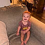 Grayson joined the competition — help win amazing prizes! baby, child, smiling, couch, living_room, indoor, furniture, table, tablecloth, wooden_table, floor, happy, person, seated, infant, cozy, home, decor, toes, casual_clothing