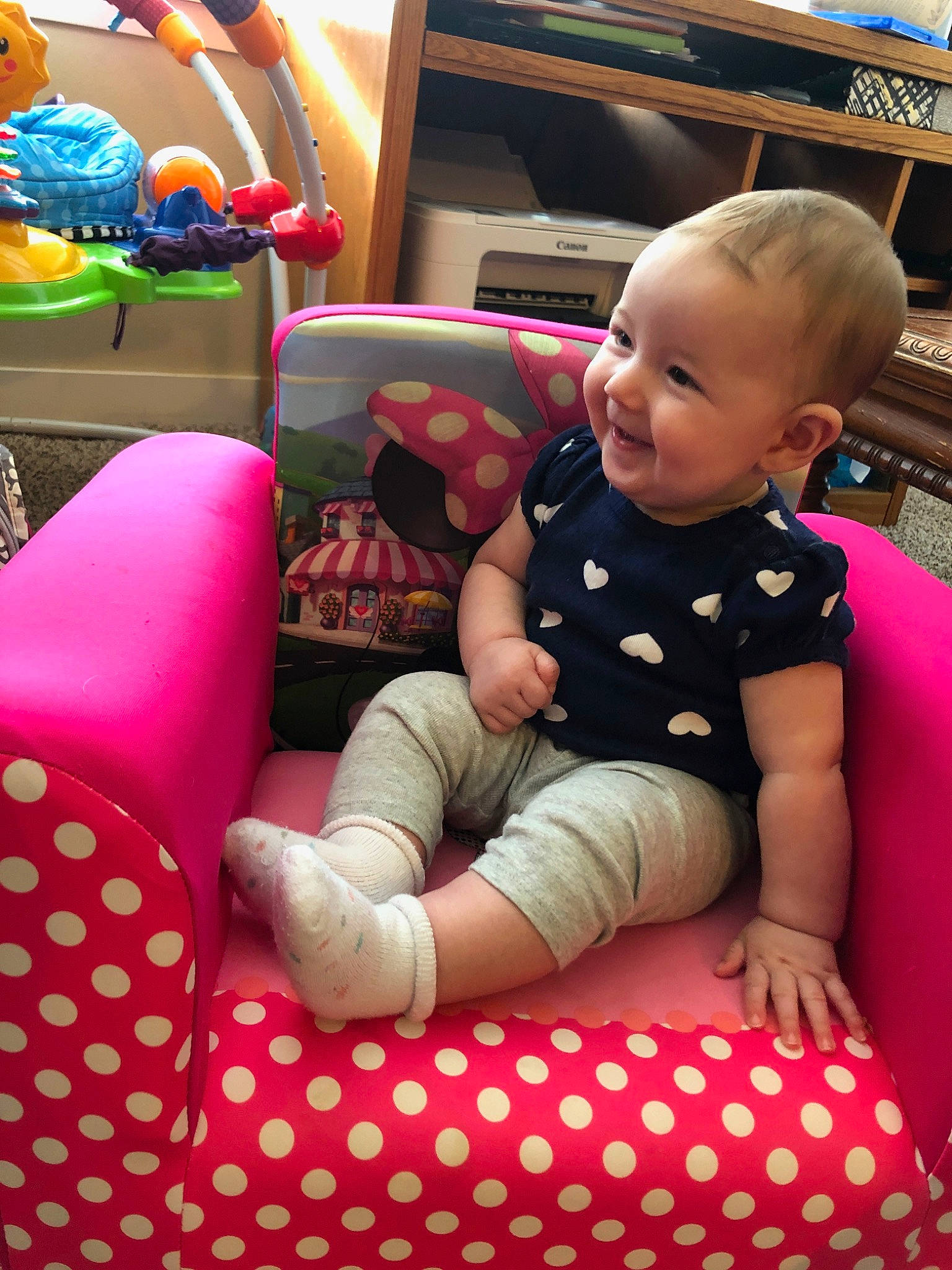 Ainsleigh is registered to the contest to win money with this photo: baby, child, design, furniture, games, leisure, pattern, person, pink, play, polka_dot, sitting, toddler, toy