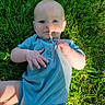 Rykir joined the competition — help win amazing prizes! baby, child, grass, outdoor, blue_clothing, romper, sunlight, shadow, face, hand, legs, nature, greenery, person, infant, summer, casual, cute, portrait, lying_down